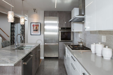 Example of a mid-sized minimalist l-shaped ceramic tile eat-in kitchen design in DC Metro with an undermount sink, flat-panel cabinets, white cabinets, quartz countertops, gray backsplash, ceramic backsplash, stainless steel appliances and an island