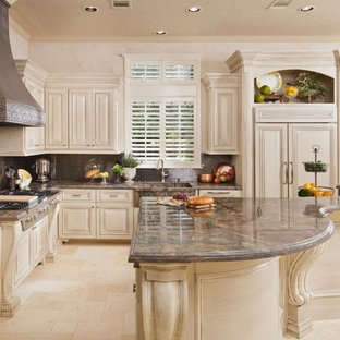 This is an example of a traditional l-shaped eat-in kitchen in Houston with an integrated sink, beige cabinets, metallic splashback, metal splashback, stainless steel appliances, travertine floors, beige floor and brown benchtop.