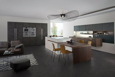 Inspiration for a contemporary kitchen in London with an island.