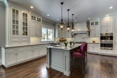 Example of a classic dark wood floor kitchen design in Boston with beaded inset cabinets, white cabinets and granite countertops