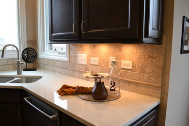Kitchen - traditional medium tone wood floor kitchen idea in Chicago with beige backsplash and ceramic backsplash