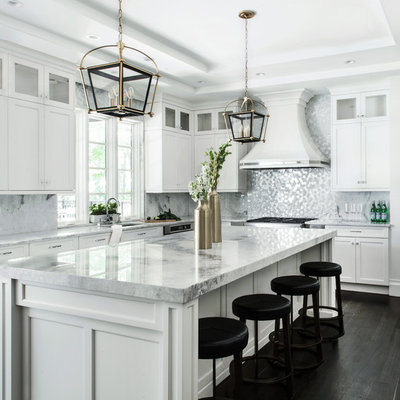 Huge transitional dark wood floor kitchen photo in New York with an undermount sink, shaker cabinets, white cabinets, quartzite countertops, stainless steel appliances, an island and metallic backsplash