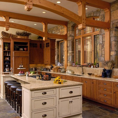 Kitchen - rustic l-shaped slate floor kitchen idea in DC Metro with an undermount sink, recessed-panel cabinets, medium tone wood cabinets and an island