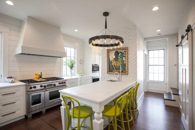 Inspiration for a transitional kitchen remodel in Boston with white cabinets and stainless steel appliances