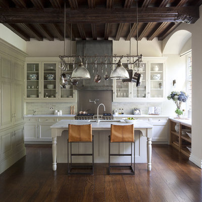 Large elegant l-shaped dark wood floor open concept kitchen photo in London with an undermount sink, recessed-panel cabinets, white cabinets, marble countertops, metallic backsplash, an island, subway tile backsplash and paneled appliances