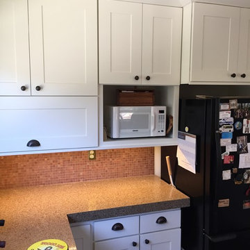 New full sized upper cabinets with refaced base cabinets