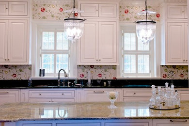 Inspiration for a huge timeless light wood floor kitchen remodel in Other with beaded inset cabinets, white cabinets, granite countertops, beige backsplash, ceramic backsplash, paneled appliances and an island