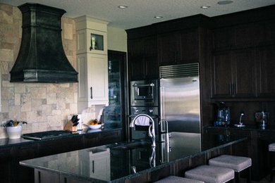 This is an example of a large modern kitchen in Calgary with an island.