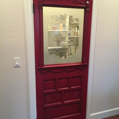 Example of a mid-sized arts and crafts u-shaped medium tone wood floor kitchen pantry design in Boise with a drop-in sink, recessed-panel cabinets, white cabinets, granite countertops, beige backsplash, subway tile backsplash, white appliances and a peninsula