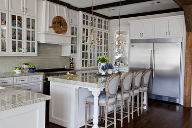 Kitchen - traditional dark wood floor kitchen idea in Houston with an island