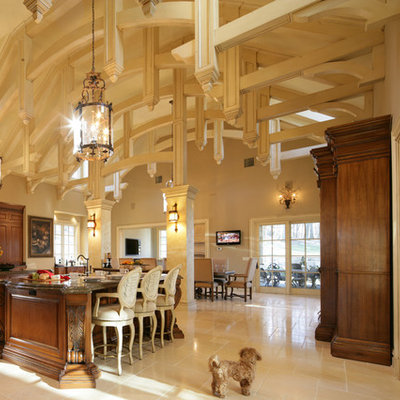 Open concept kitchen - huge traditional travertine floor open concept kitchen idea in New York with dark wood cabinets