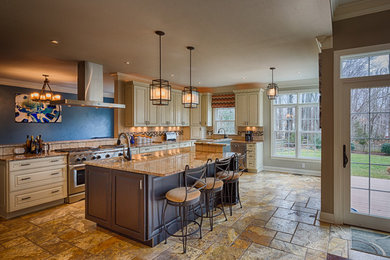 Inspiration for a large transitional u-shaped ceramic tile open concept kitchen remodel in Richmond with white cabinets, beige backsplash, stainless steel appliances, an island, an undermount sink, raised-panel cabinets, granite countertops and stone tile backsplash