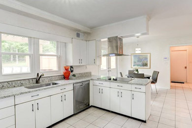 Mid-sized transitional u-shaped ceramic tile and white floor eat-in kitchen photo in DC Metro with an undermount sink, flat-panel cabinets, white cabinets, granite countertops, stainless steel appliances and a peninsula