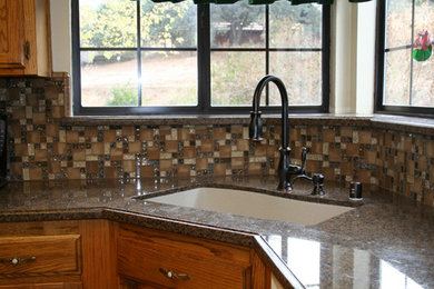 Example of a mid-sized classic kitchen design in Other with medium tone wood cabinets, granite countertops, multicolored backsplash and ceramic backsplash