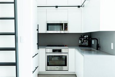 Example of an urban kitchen design in Vancouver
