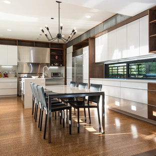 Huge contemporary eat-in kitchen remodeling - Inspiration for a huge contemporary u-shaped bamboo floor eat-in kitchen remodel in Orange County with flat-panel cabinets, white cabinets, stainless steel appliances, an island, metallic backsplash and a farmhouse sink