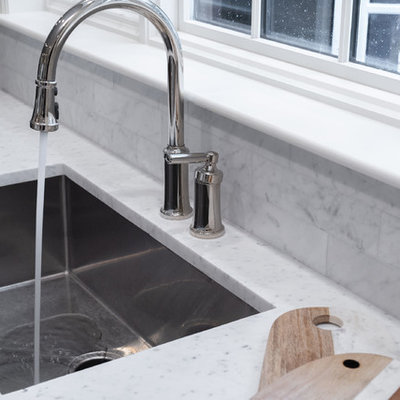 Inspiration for a huge timeless l-shaped dark wood floor and brown floor eat-in kitchen remodel in Boston with an undermount sink, beaded inset cabinets, white cabinets, marble countertops, gray backsplash, marble backsplash, stainless steel appliances, an island and white countertops