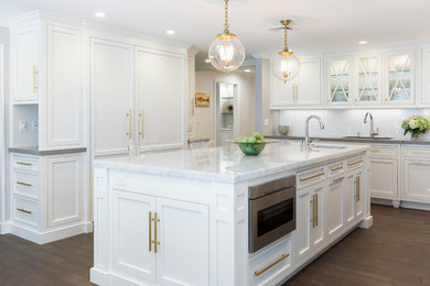 Inspiration for a mid-sized timeless l-shaped dark wood floor and brown floor eat-in kitchen remodel in Boston with white cabinets, quartz countertops, gray backsplash, stone slab backsplash, stainless steel appliances, an island, an undermount sink and shaker cabinets