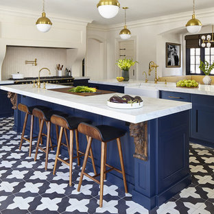 Design ideas for a transitional eat-in kitchen in New York with an undermount sink, beaded inset cabinets, blue cabinets, quartz benchtops, white splashback, ceramic splashback, stainless steel appliances, porcelain floors, multiple islands and multi-coloured floor.