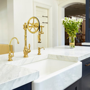 Inspiration for a transitional eat-in kitchen in New York with an undermount sink, beaded inset cabinets, blue cabinets, quartz benchtops, white splashback, ceramic splashback, stainless steel appliances, porcelain floors, multiple islands and multi-coloured floor.