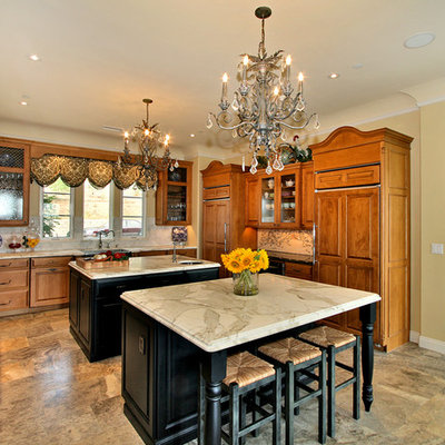 Inspiration for a timeless u-shaped kitchen remodel in San Diego with a farmhouse sink and marble countertops