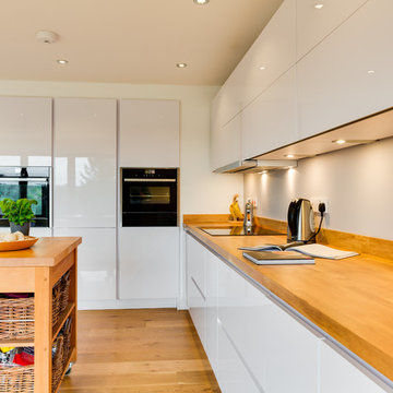 Nobilia White High Gloss Kitchen with Solid wood worktop