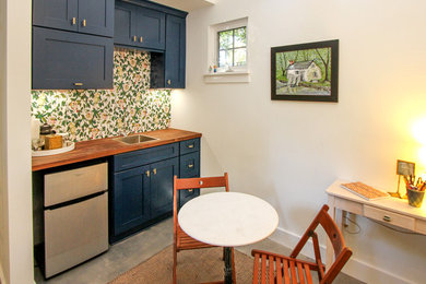 Small arts and crafts galley kitchen photo in Charlotte with shaker cabinets and blue cabinets