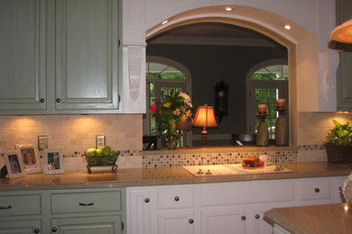 Mid-sized elegant kitchen photo in Atlanta with green cabinets and an island