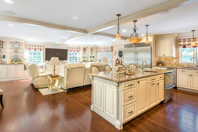 Mid-sized elegant u-shaped dark wood floor and brown floor eat-in kitchen photo in Providence with a double-bowl sink, raised-panel cabinets, granite countertops, ceramic backsplash, stainless steel appliances, an island, white cabinets and beige backsplash