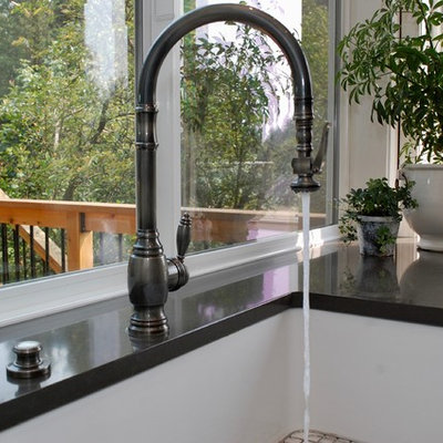 Example of a large classic u-shaped medium tone wood floor open concept kitchen design in Portland with an undermount sink, beaded inset cabinets, white cabinets, quartz countertops, beige backsplash, glass tile backsplash, stainless steel appliances, an island and black countertops