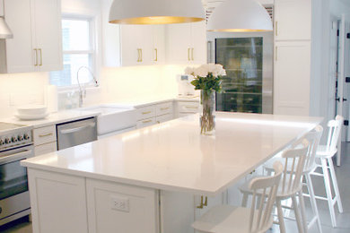 Kitchen - kitchen idea in New York with a farmhouse sink and quartz countertops
