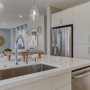 Open concept kitchen inspiration - Inspiration for a l-shaped open concept kitchen remodel in San Francisco with flat-panel cabinets, white cabinets, an island and white countertops
