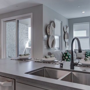 Open concept kitchen designs - Open concept kitchen - l-shaped beige floor open concept kitchen idea in San Francisco with an undermount sink, recessed-panel cabinets, white backsplash, stainless steel appliances and an island