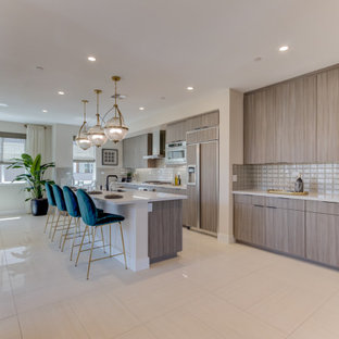 Open concept kitchen designs - Inspiration for a single-wall open concept kitchen remodel in San Francisco with an undermount sink, light wood cabinets, paneled appliances and an island