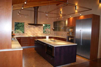 Large trendy u-shaped cork floor and brown floor eat-in kitchen photo in Seattle with a double-bowl sink, flat-panel cabinets, medium tone wood cabinets, quartz countertops, beige backsplash, ceramic backsplash, stainless steel appliances and an island