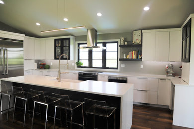 Inspiration for a contemporary u-shaped medium tone wood floor and brown floor open concept kitchen remodel in Other with a farmhouse sink, flat-panel cabinets, white cabinets, quartz countertops, stainless steel appliances, an island and white countertops