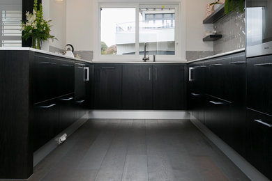 This is an example of a large kitchen in Other.