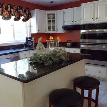 Oak kitchen cabinets painted white.