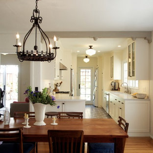 Design ideas for a small mediterranean galley separate kitchen in San Francisco with an undermount sink, shaker cabinets, white cabinets, quartz benchtops, white splashback, subway tile splashback, stainless steel appliances, ceramic floors and no island.