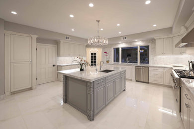 Large elegant enclosed kitchen photo with raised-panel cabinets, white cabinets, marble countertops, gray backsplash, an island and white countertops
