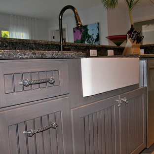 Inspiration for a mid-sized transitional l-shaped eat-in kitchen in Miami with a farmhouse sink, louvered cabinets, beige cabinets, granite benchtops, multi-coloured splashback, mosaic tile splashback, stainless steel appliances, porcelain floors and with island.