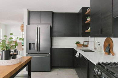 Photo of a small scandinavian l-shaped kitchen pantry in Tampa with a built-in sink, flat-panel cabinets, black cabinets, engineered stone countertops, white splashback, engineered quartz splashback, black appliances, ceramic flooring, an island, grey floors and white worktops.