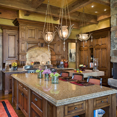Inspiration for a rustic kitchen remodel in Other with raised-panel cabinets, medium tone wood cabinets, beige backsplash and stainless steel appliances