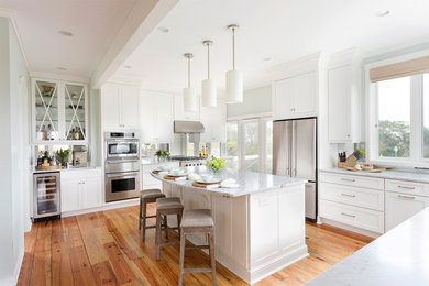 Beach style kitchen photo in San Francisco with shaker cabinets, white cabinets and stainless steel appliances