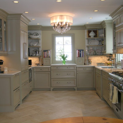 Enclosed kitchen - traditional travertine floor enclosed kitchen idea in Newark with paneled appliances, an undermount sink, recessed-panel cabinets, green cabinets, quartz countertops, white backsplash and stone tile backsplash