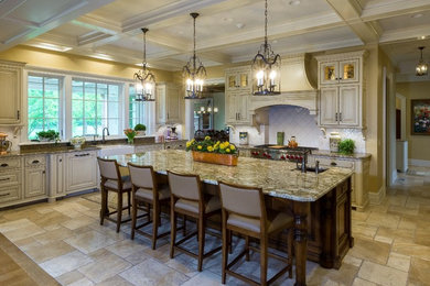 Example of a huge tuscan u-shaped limestone floor and beige floor open concept kitchen design in Columbus with a farmhouse sink, beaded inset cabinets, white cabinets, granite countertops, white backsplash, ceramic backsplash, an island and white countertops