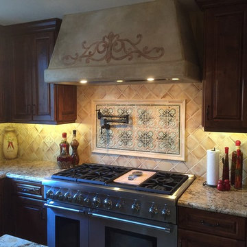 Old world plaster on Kitchen hood with hand painted art work