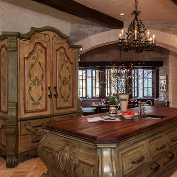 Old world true custom kitchen island and refrigerator armoire