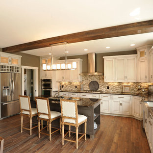 Inspiration for a timeless u-shaped kitchen remodel in Columbus with stainless steel appliances, a single-bowl sink, recessed-panel cabinets, white cabinets, matchstick tile backsplash and multicolored backsplash