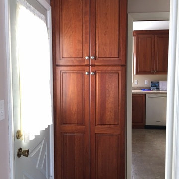 Omega Cabinetry, Portage door, Cherry wood, Nutmeg stain.